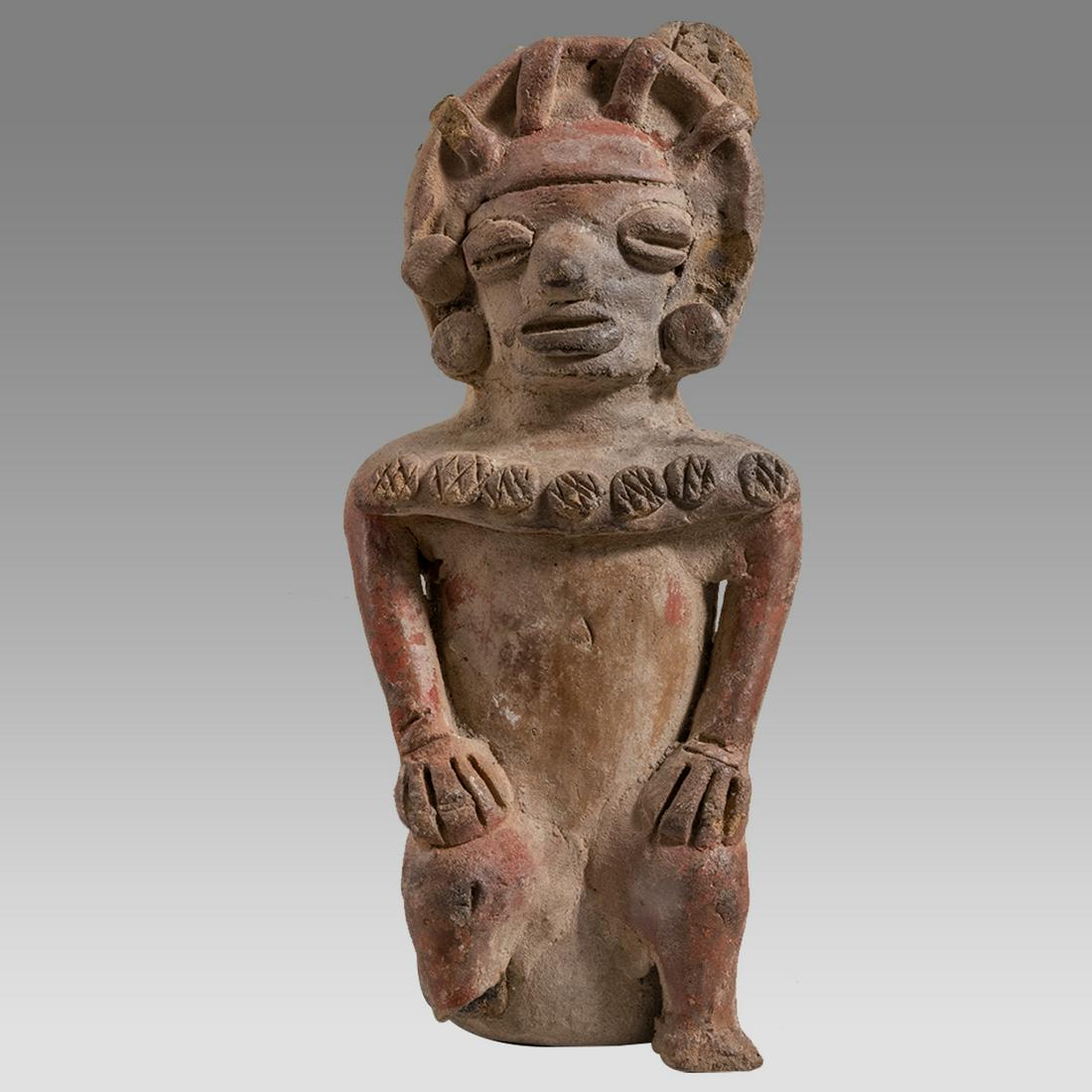 Pre-Columbian, Ecyador, La Tolita- Tumaco c.350 BC.350 AD.: Pre-Columbian, Ecyador, La Tolita- Tumaco c.350 BC.350 AD. Size 7 7/8 inches high. A fine hand-formed figure depicting a seated Shaman wearing a decorated shawl. The Shaman wears and elaborate headdre