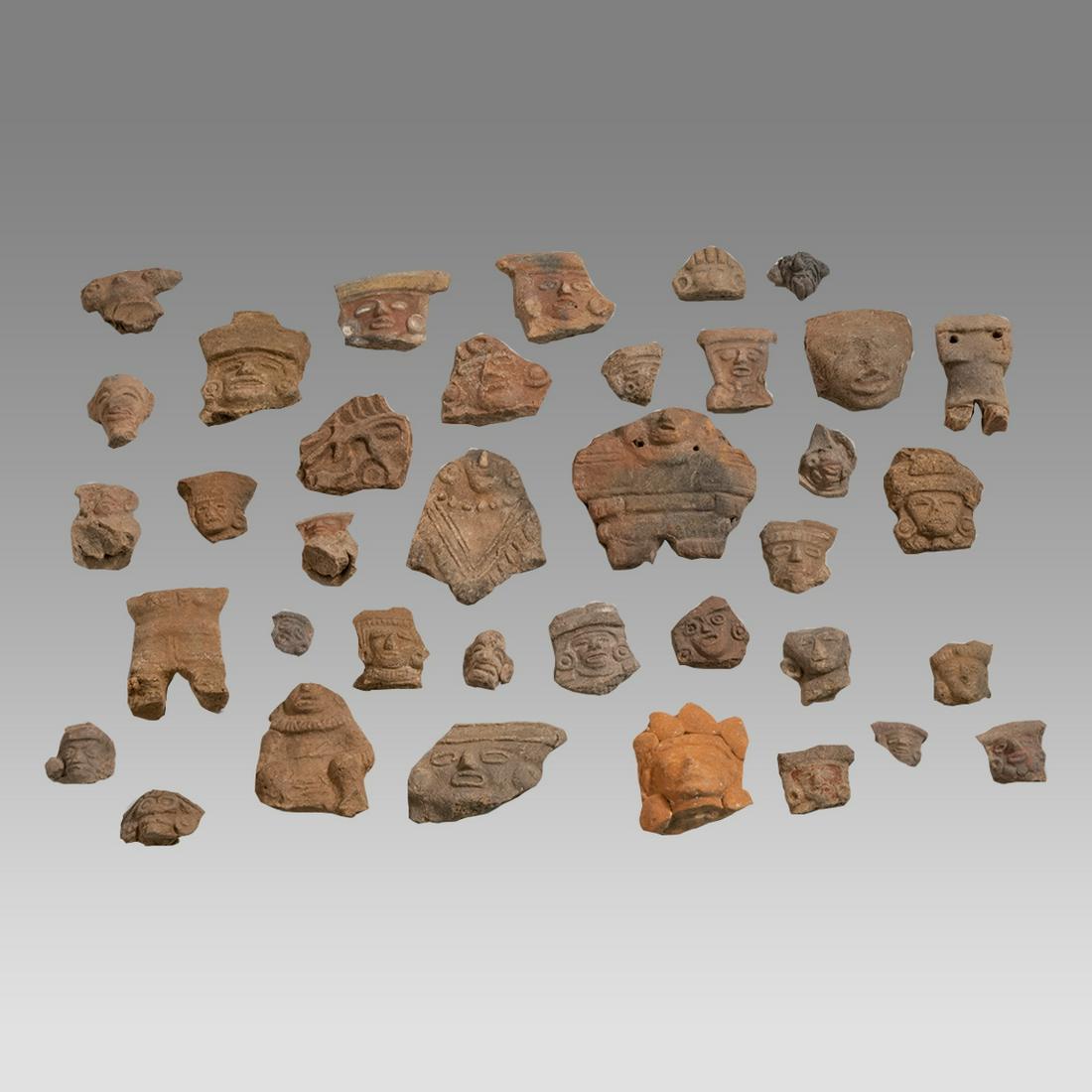 Lot of 38 Ancient Group of Molded Heads Michoacan Mexico Archaic Period c.200 BC.: Lot of 38 Ancient Group of Molded Heads Michoacan Mexico Archaic Period c.200 BC. Size 0 3/4 - 3 inches. Fine lot of 38 Group of Molded Heads. Fragments from full figures. Provenance: Ex. Lorenz Boren