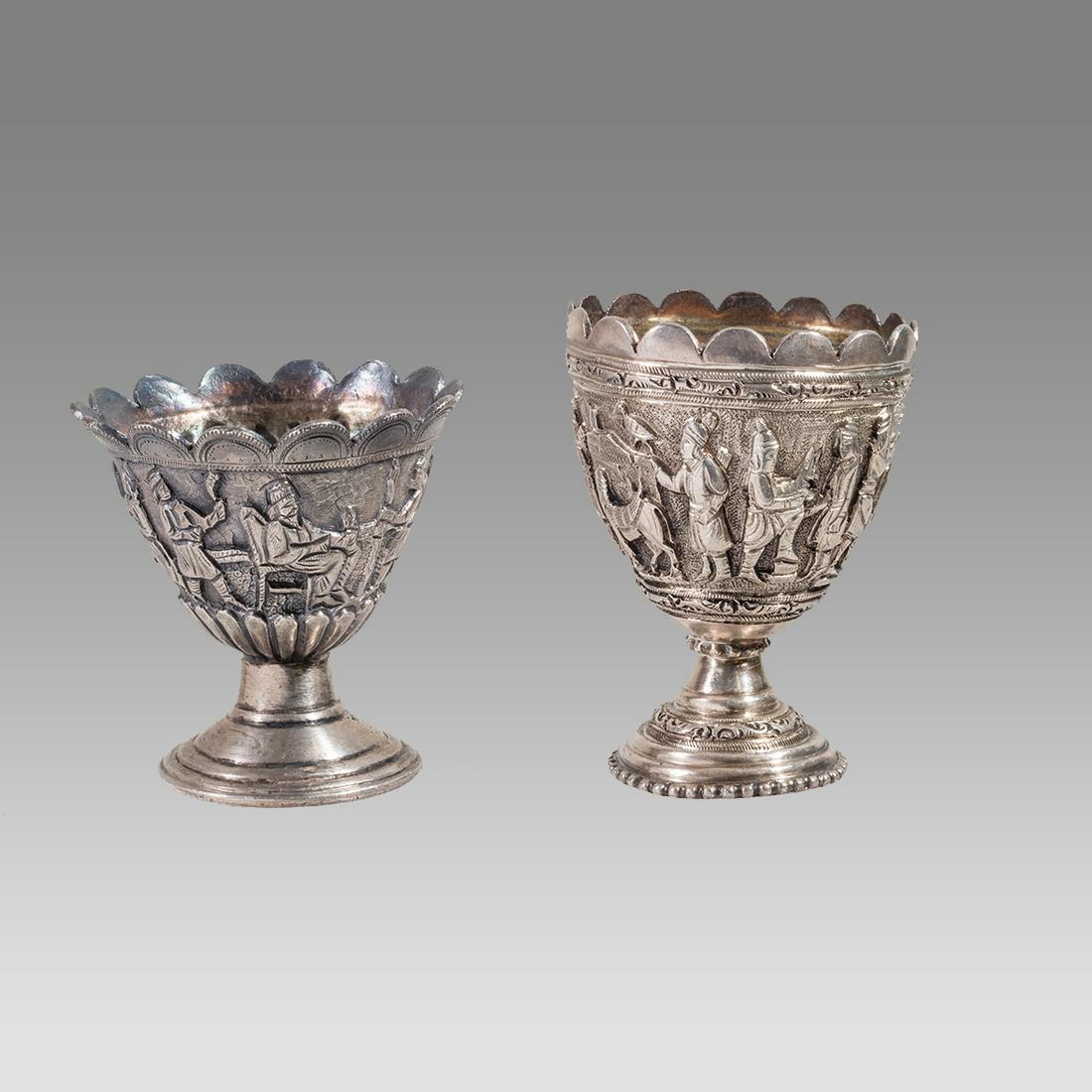 Lot of 2 Persian Qajar Egg SIlver Cups.: Lot of 2 Persian Qajar Egg SIlver Cups. Size 2 1/8 - 2 3/8 inches high. Fine silver footed cup or egg holder decorated with figures. total weight 133.13 grams.