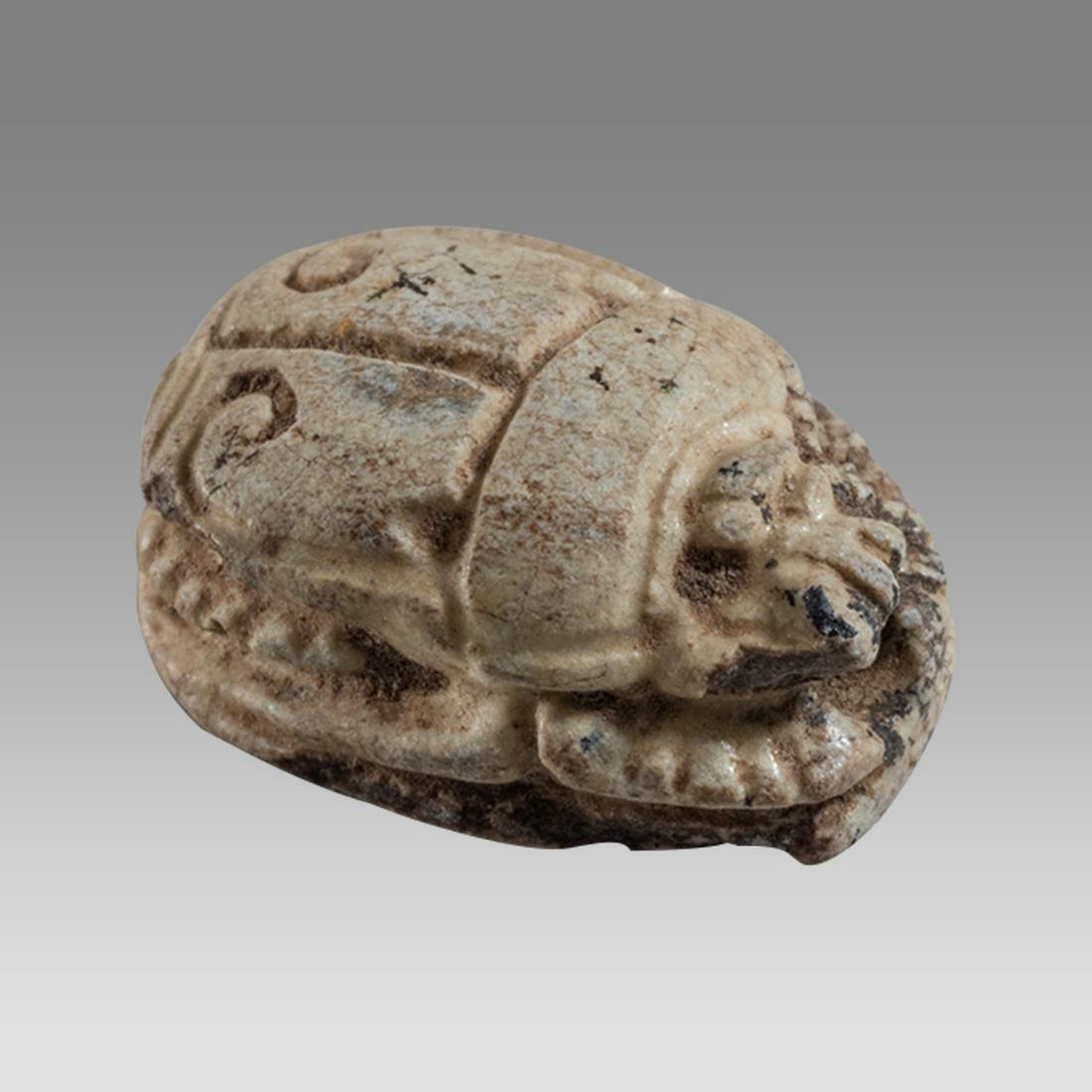 Ancient Egyptian Steatite stone Scarab New Kingdom c.1400-1390 BCE. Tuthmose III: Ancient Egyptian Steatite stone Scarab New Kingdom c.1400-1390 BCE. Tuthmose III Cartouche. Size 11 x 8 mm. Glazed steatite scarab New Kingdom with stealized beatle back. Provenance: Ex Secret Eyes Ga