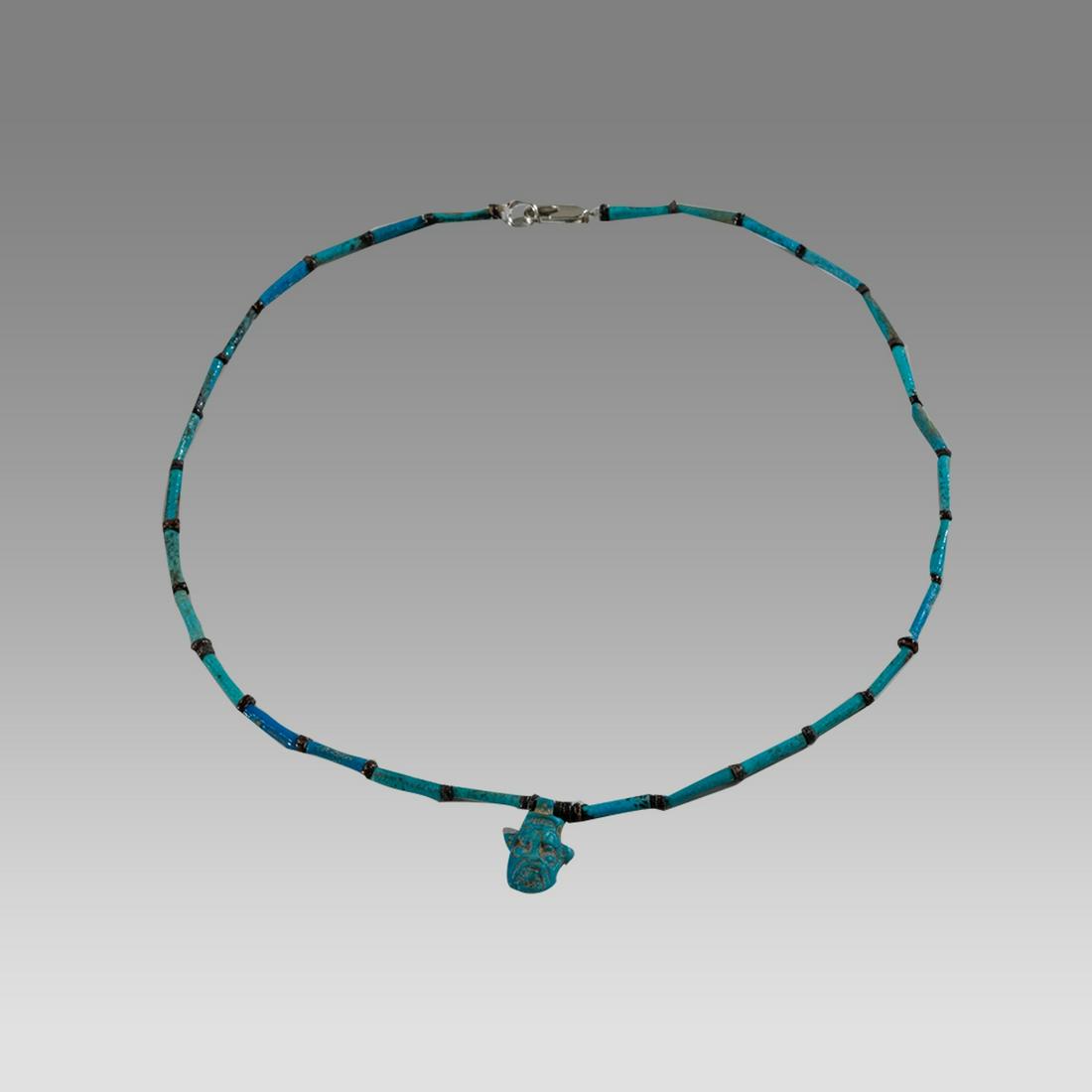 Ancient Egyptian Faience, Bead Necklace with Bes Amulet c.300-50 BC.: Ancient Egyptian Faience, Bead Necklace with Bes Amulet c.300-50 BC. Size 17 inches length. Great Looking single strand Faience Bead necklace with fine blue faience Bes amulet. wearable. Provenance: E
