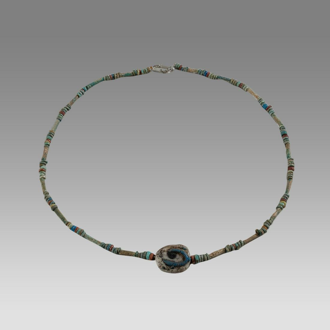 Ancient Egyptian Faience, Bead Necklace with Eye of Horus Amulet c.300-50 BC.: Ancient Egyptian Faience, Bead Necklace with Eye of Horus Amulet c.300-50 BC. Size 19 inches length. Great Looking single strand Faience Bead necklace with Rare Glass Eye of Horus amulet. wearable. Pr
