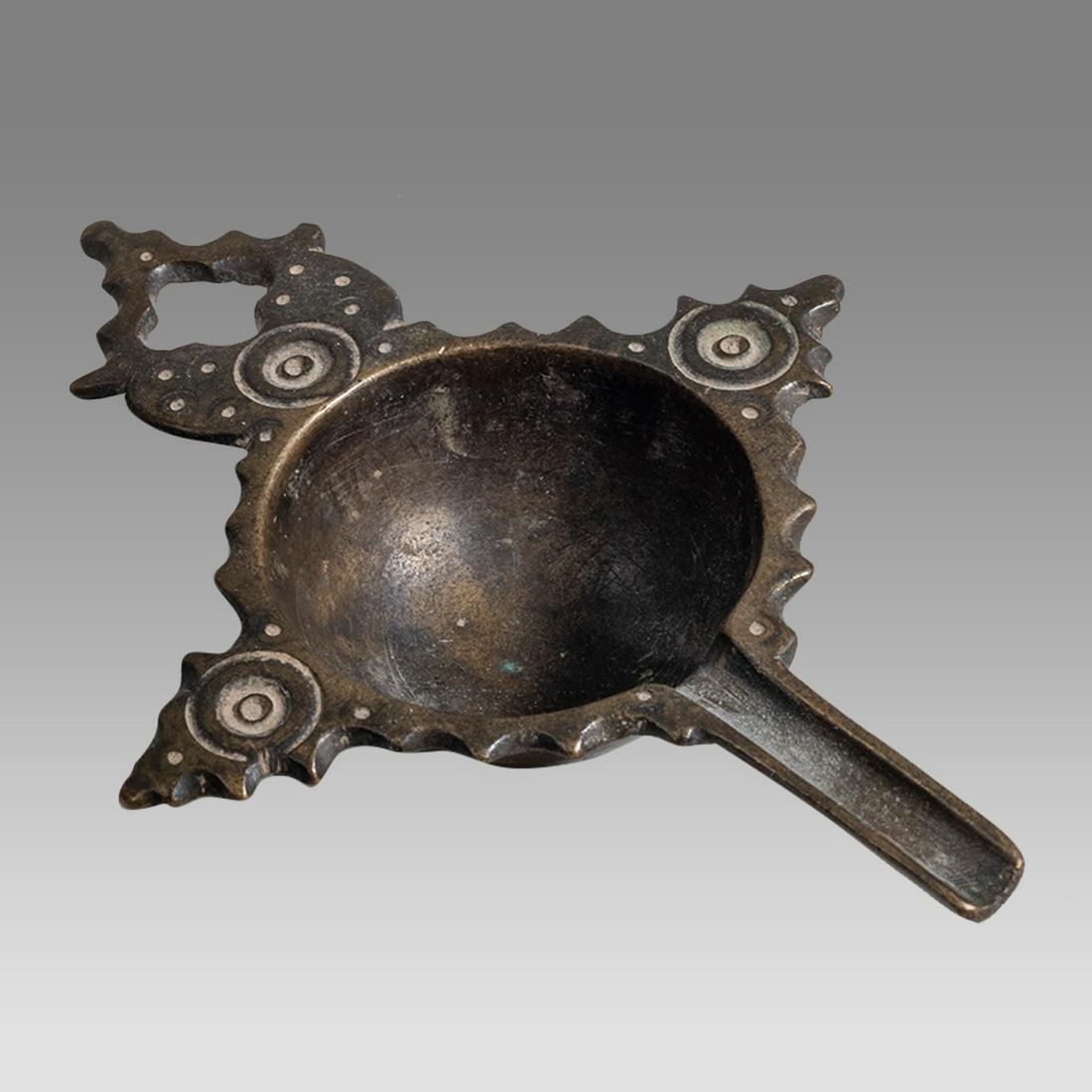 Ancient Byzantine Bronze Oil Lamp Filler c.8th century AD.: Ancient Byzantine Bronze Oil Lamp Filler c.8th century AD. Size 5 1/4 inches length. Fine cast bronze oil lamp filler with Open work Cross handle and circle design. Fine quality and patina. Provenance