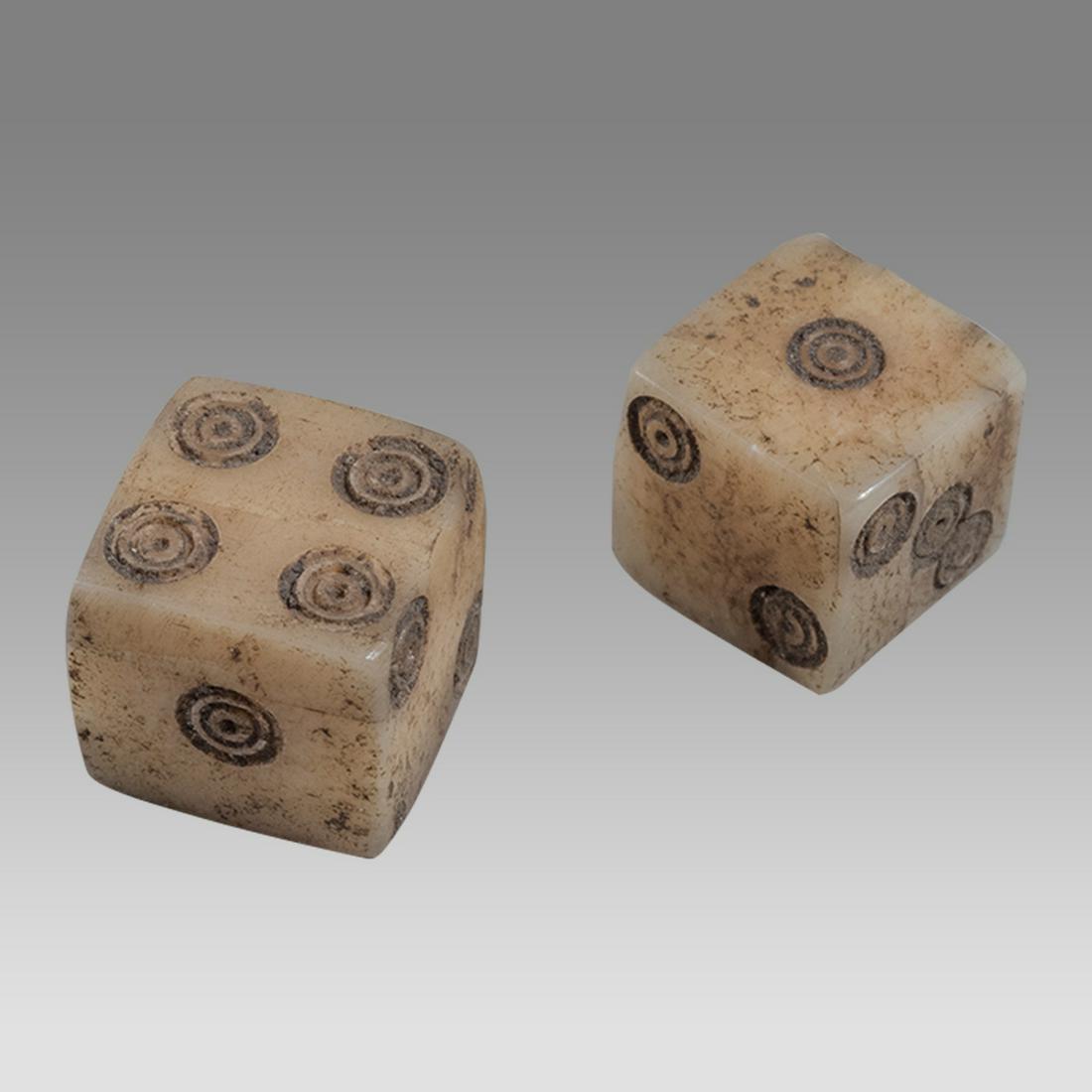 Ancient Roman Bone pair of Dice c.2nd century AD.: Ancient Roman Bone pair of Dice c.2nd century AD. Size 8 mm. Fine carved bone pair of dice. Provenance: Private NYC Dr Collection acquired 1990s