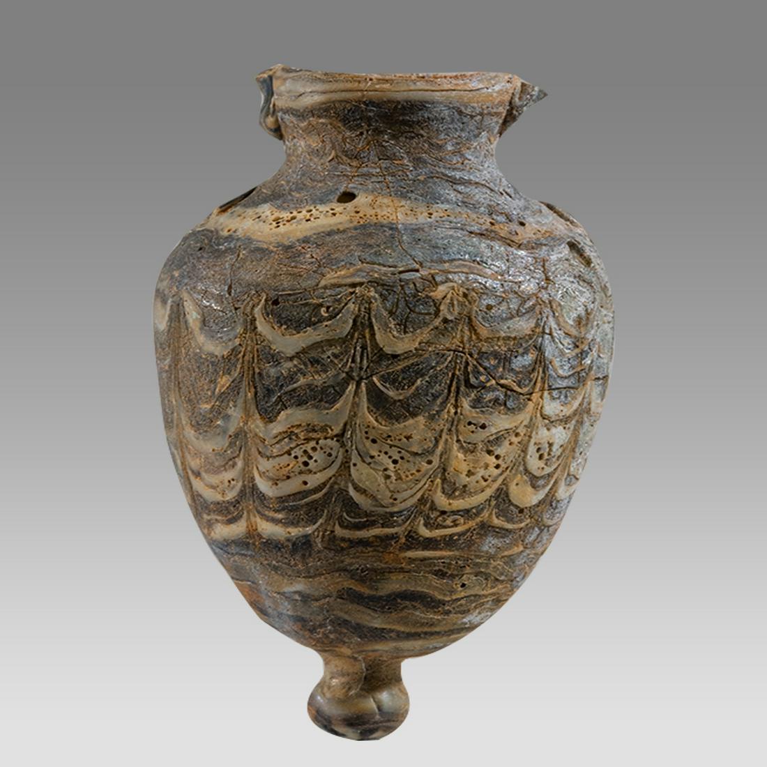 Phoenician Core form Glass Amphora.: Phoenician Core form Glass Amphora. Size 3 inches high. Unusual Sand core form glass amphoriskos, missing handles restored. Provenance: Private NYC Collection acquired in The London Market 1990s