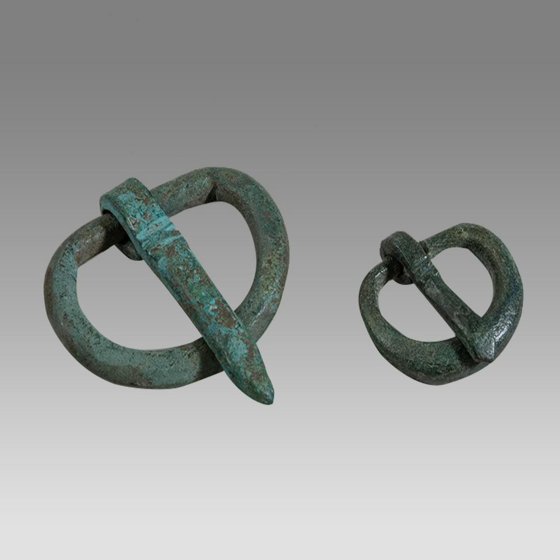 Lot of 2 Ancient Roman Bronze Belt Buckles c.1st-2nd century AD.: Lot of 2 Ancient Roman Bronze Belt Buckles c.1st-2nd century AD. Size 0 3/4 - 1 1/4 inches length. A collection of 2 bronze belt buckles. Provenance: Collection of David Van Vleck, Jr of Brooklyn NY a