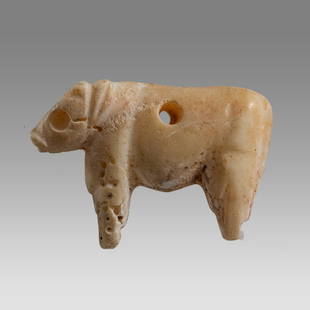 Ancient Holy Land Bronze Age Shell Cow c.3000 BC.: Ancient Holy Land Bronze Age Shell Cow c.3000 BC. Size 34 mm. Rare Carved shell amulet of a cow with a hole through the center. Condition: perfect. Provenance: from the estate of Robert Thompson of Ph