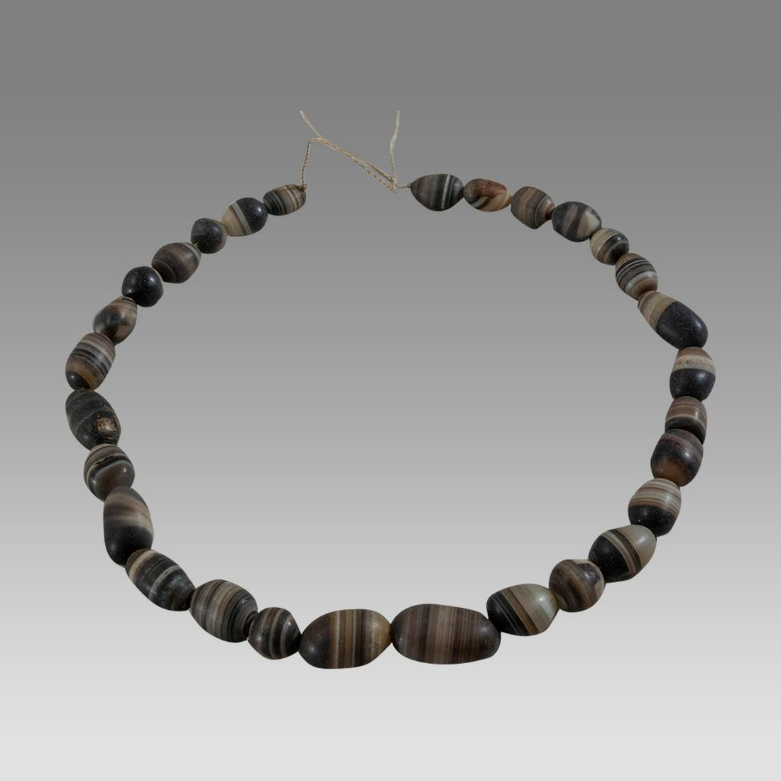 Near Eastern Banded Agate Bead Necklace.: Near Eastern Banded Agate Bead Necklace. Size 16 inches length. Size of beads 12-23 mm. Fine single strand large banded agate beads. wearable. Provenance: Ex Pegasi Numismatics MI