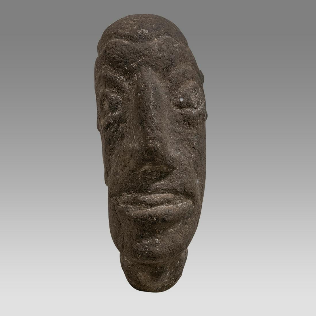 Costa Riccan Basalt Stone head of a man.: Costa Riccan Basalt Stone head of a man. Size 7 3/4 inches high. Carved basalt stone head of a man, possibly Costa Riccan? Provenance: Ex Nancy Lagalle NY.