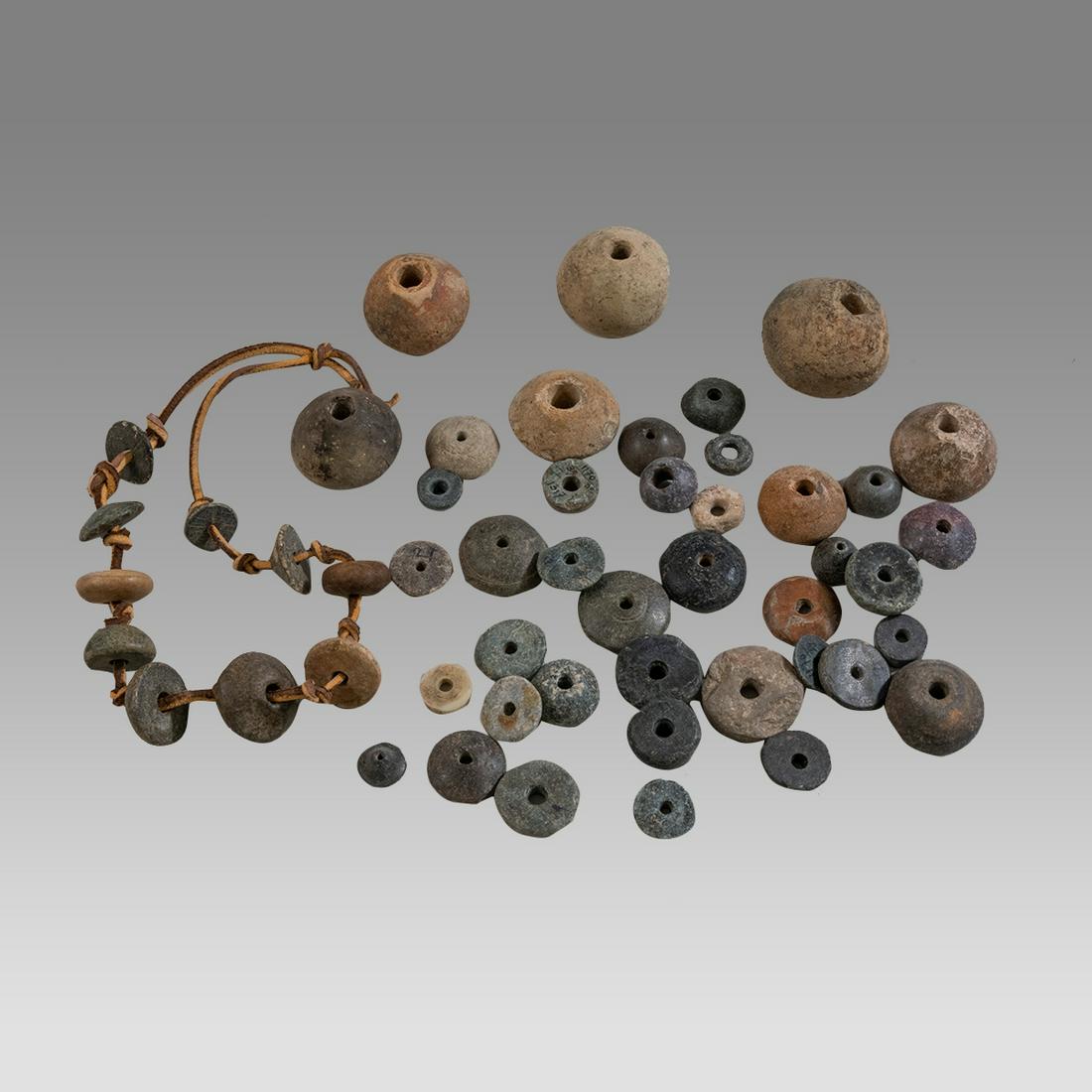 Lot of 50+ Ancient Roman and Pre Columbian Spindle Whorls c. 600 BC-200 AD. (1 of 1)