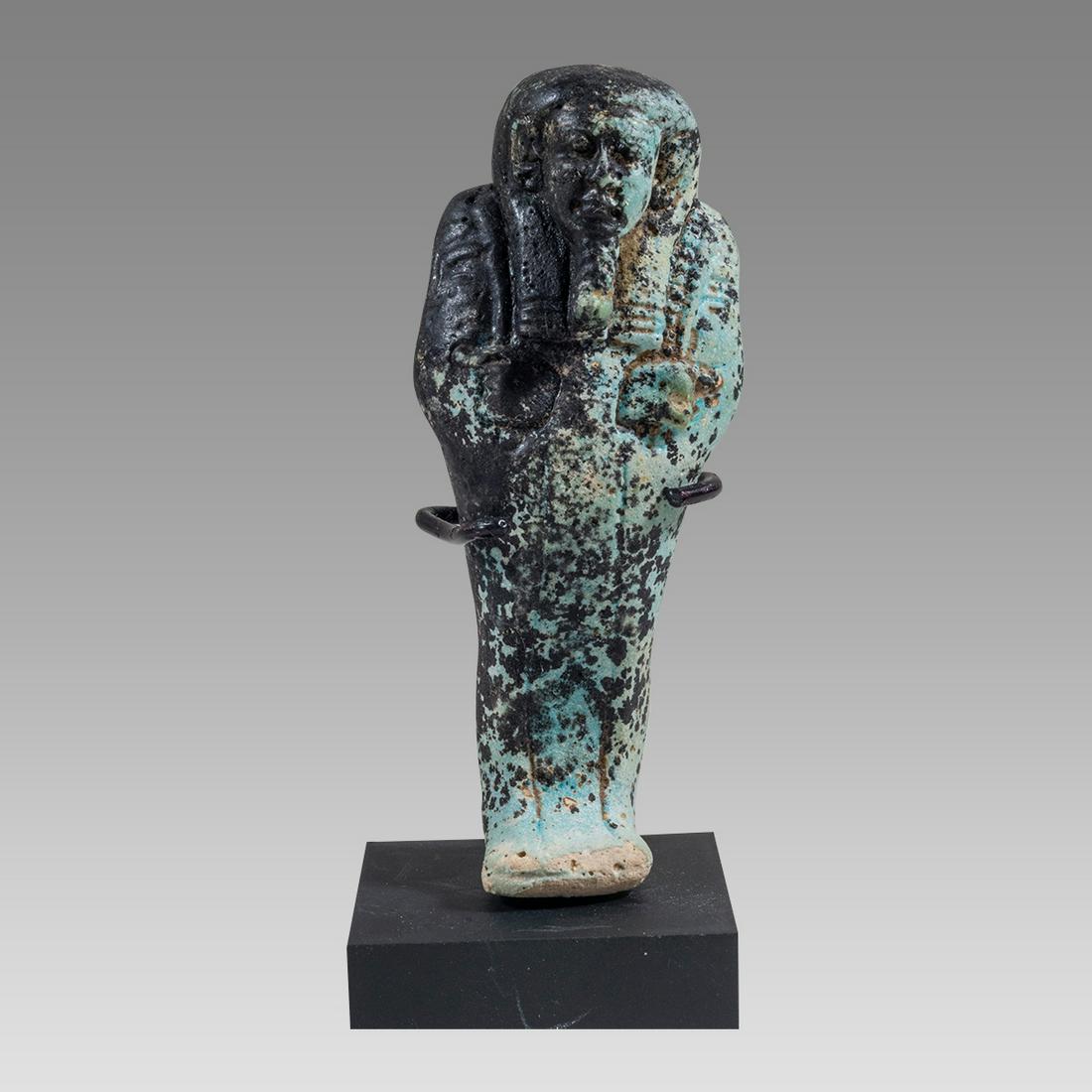 Ancient Egyptian Ushapti, Blue and Black Faience late period c.600 BC.: Ancient Egyptian Ushapti, Blue and Black Faience late period c.600 BC. Size 3 1/4 inches high. Fine faience Ushabti with great face details. EU- 19 JBird Ushapti a-c. Provenance: ex Canadian Collectio