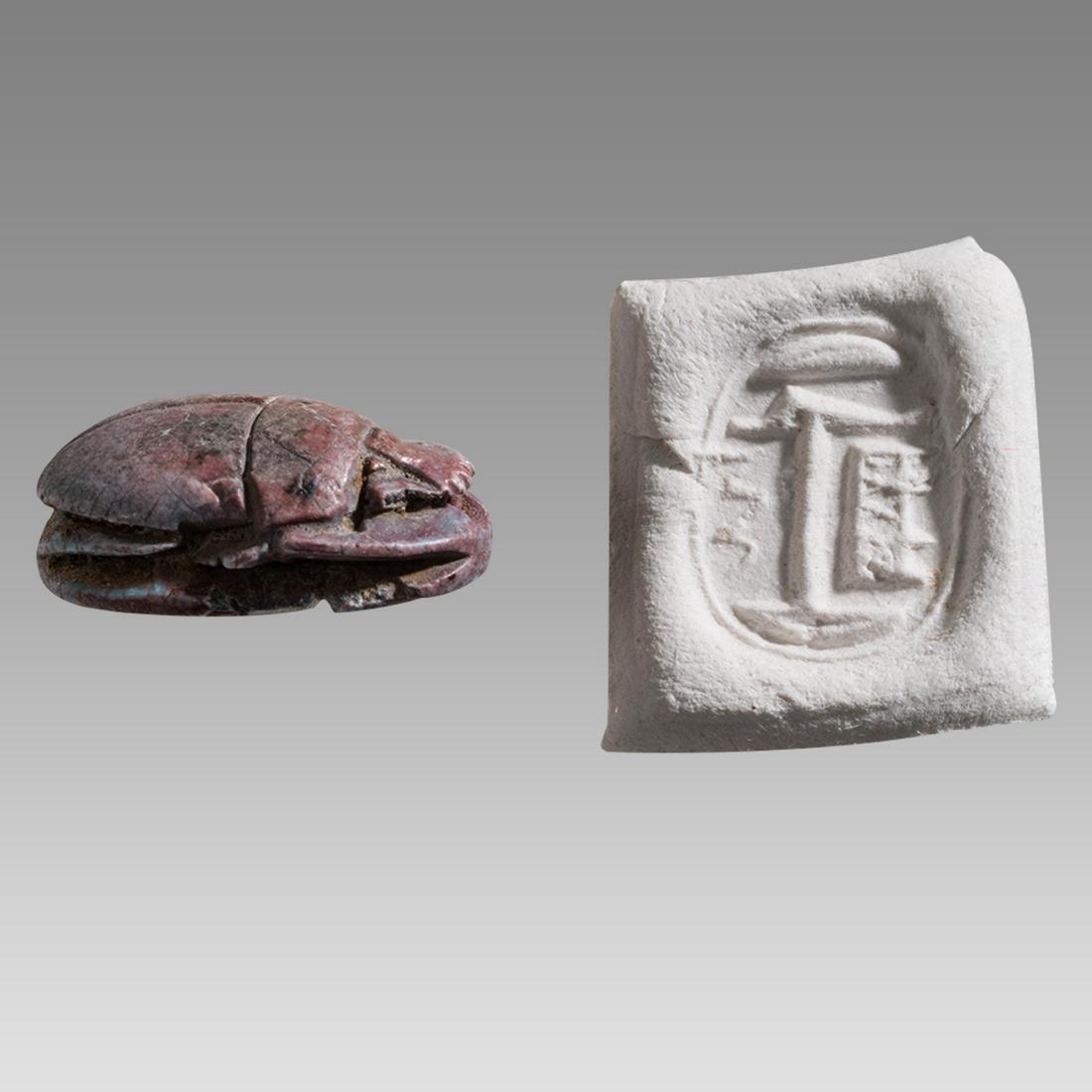 Ancient Egyptian Scarab, red granite with offering table with one leg as Maat feather, (1 of 2)