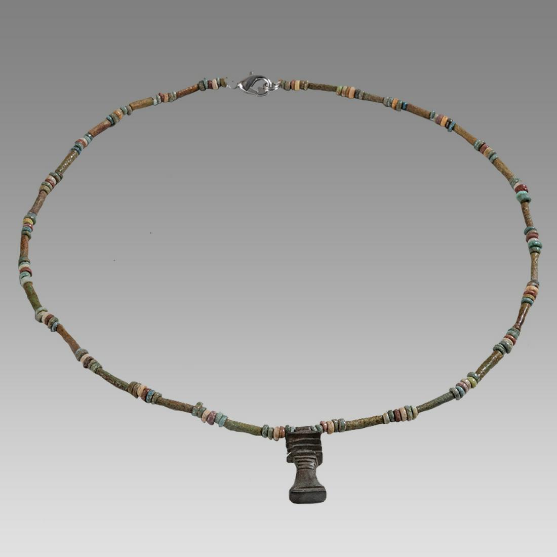 Ancient Egyptian Faience, Bead Necklace with Djed Amulet c.300-50 BC.: Ancient Egyptian Faience, Bead Necklace with Djed Amulet c.300-50 BC. Size 19 inches length. Great Looking single strand Faience Bead necklace with fine green faience amulet. wearable. Provenance: Ex 