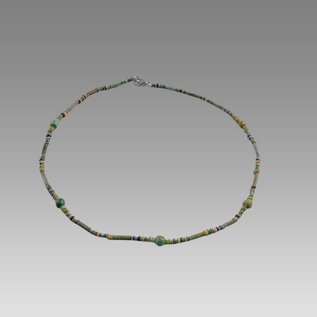 Ancient Egyptian Faience, Bead Necklace c.300-50 BC.: Ancient Egyptian Faience, Bead Necklace c.300-50 BC. Size 20 inches length. Great Looking single strand Faience Bead necklace with 5 Roman green glass beads. wearable. Provenance: Ex Secret Eyes Galle