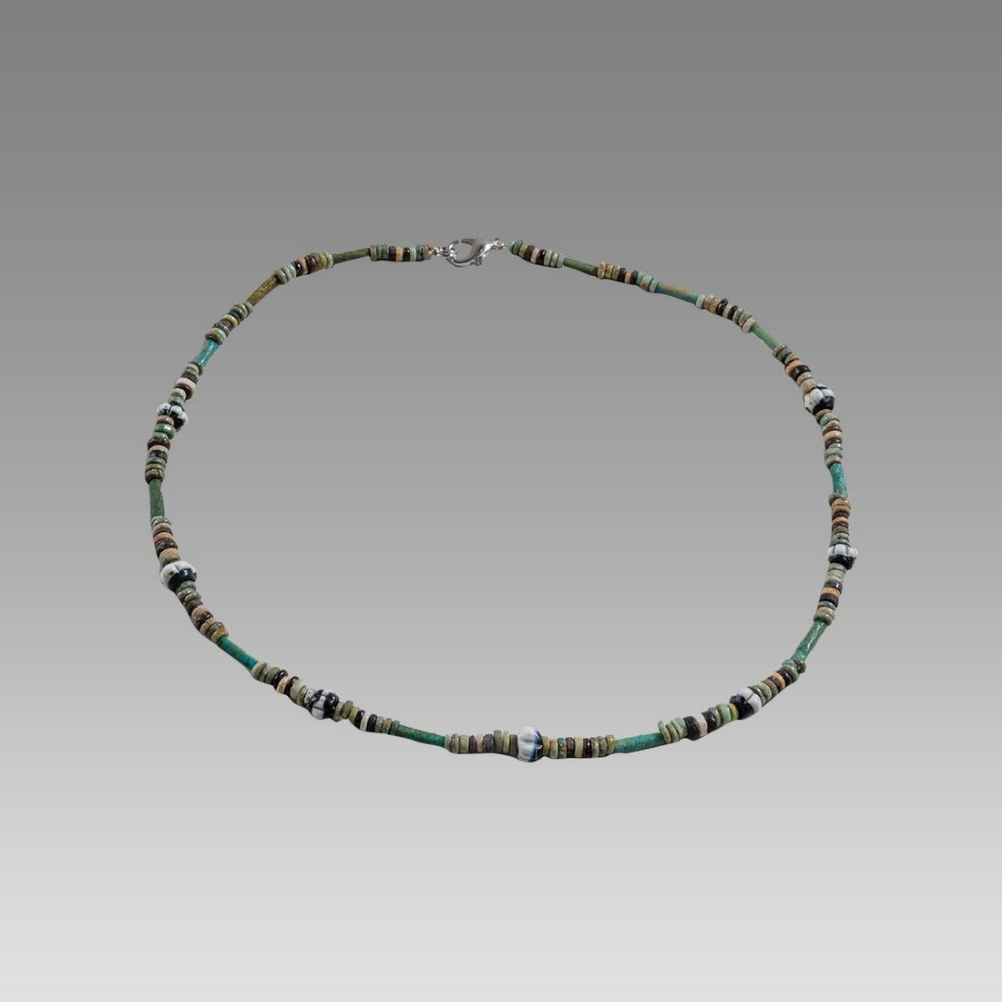 Ancient Egyptian Faience, Bead Necklace c.300-50 BC.: Ancient Egyptian Faience, Bead Necklace c.300-50 BC. Size 18 3/8 inches length. Great Looking single strand Faience Bead necklace with 7 Roman black and white glass beads. wearable. Provenance: Ex Sec
