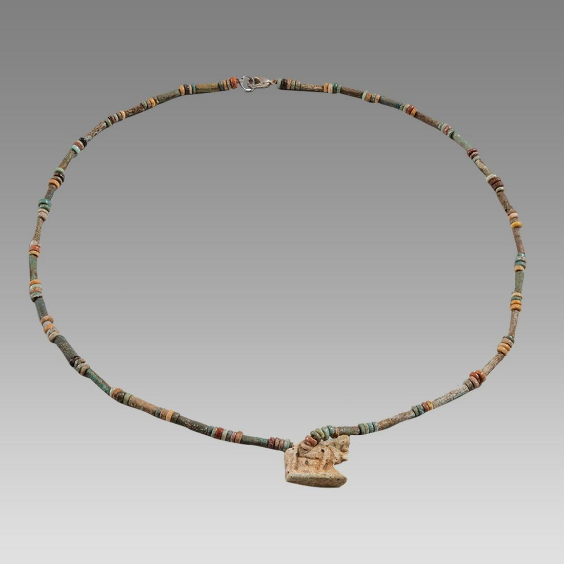 Ancient Egyptian Faience, Apis Bull Amulet Necklace c.300-50 BC.: Ancient Egyptian Faience, Apis Bull Amulet Necklace c.300-50 BC. Size 20 1/4 inches length. Great Looking single strand Faience Bead necklace with Apis Bull Faience amulet. wearable. Provenance: Ex Se
