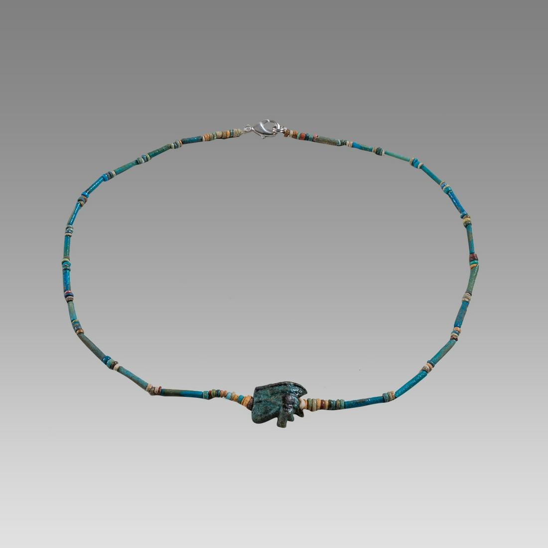 Ancient Egyptian Faience, Eye Of Horus Amulet Necklace c.300-50 BC.: Ancient Egyptian Faience, Eye Of Horus Amulet Necklace c.300-50 BC. Size 18 3/4 inches length. Great Looking single strand Faience Bead necklace with Eye Of Horus Faience amulet. wearable. Provenance: