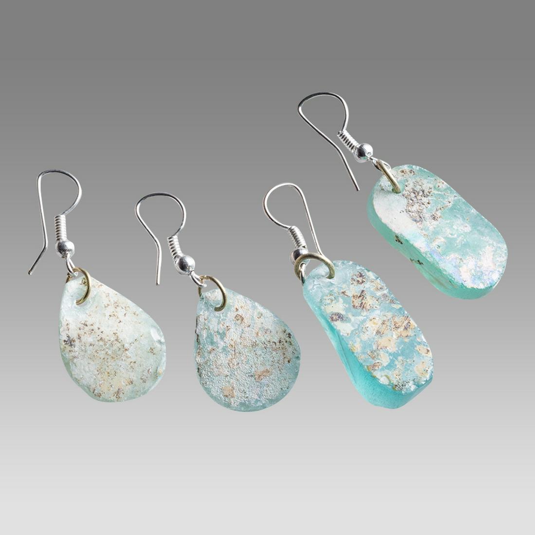 Lot of 2 Ancient Roman Glass Fragment set in silver earrings. (1 of 2)