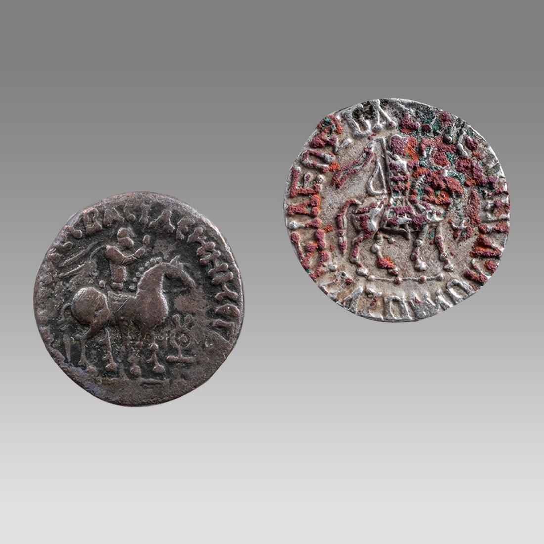 Lot of 2 Azes II silver tetradrachms, 35 BC - 5 AD.: Lot of 2 Azes II silver tetradrachms, 35 BC - 5 AD. Size 22/23 mm. King on horseback holding whip; la in Kharosthi to right / Athena standing right, holding spear and shield, monograms in field. Fine