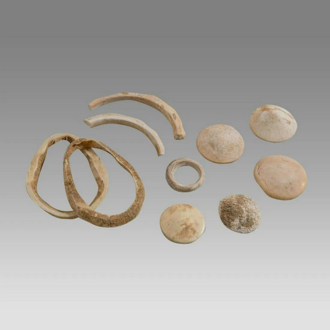 Lot of 10 Ancient Mesopotamian Shell ring, Buttons c.3000 BC.: Lot of 10 Ancient Mesopotamian Shell ring, Buttons c.3000 BC. Size 1 - 2 1/4 inches length. A collection of Ancient Shell rings and butons. Provenance: Private NYC Collection acquired 1970s