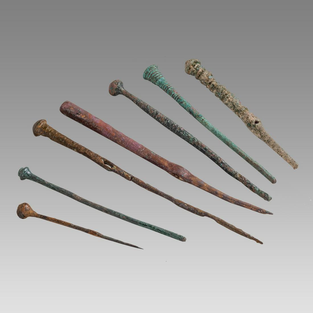 Lot of 7 Ancient Holland, Bronze Age, Bronze Pins, Needles c.1000-500 BC.: Lot of 7 Ancient Holland, Bronze Age, Bronze Pins, Needles c.1000-500 BC. Size 2 1/2 - 5 1/2 inches length. A cast bronze lot of 7 pins and needles with hole through. Provenance: Collection of David V