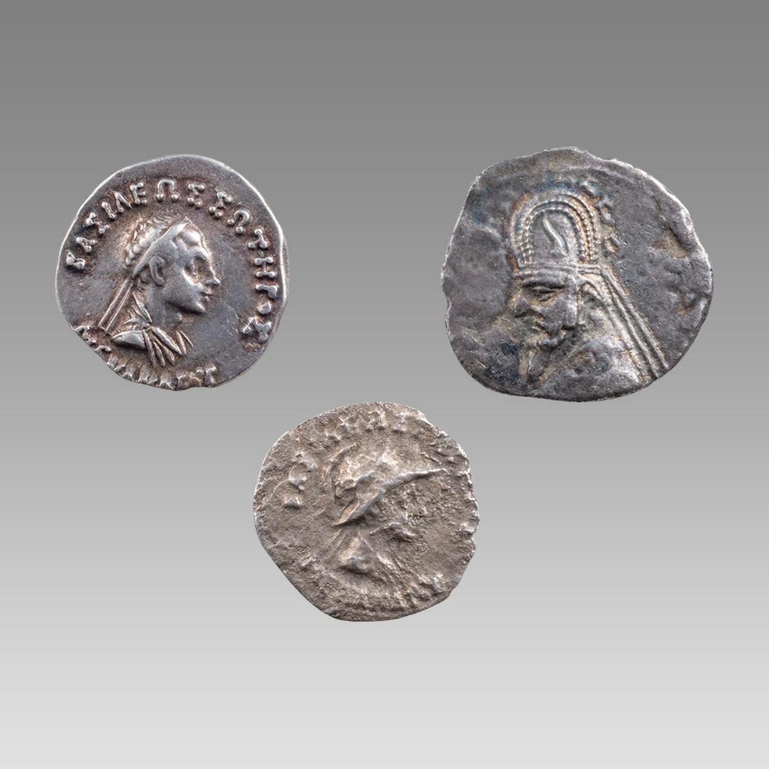 Lot of 2 Indo Greek Menander Silver Drachm, Parthian Drachm Orodes I (3): Lot of 2 Indo Greek Menander Silver Drachm, Parthian Drachm Orodes I (3) Size 16-19 mm. Lot of 2 Menander I Ssilver drachms c.165 BC together with a Parthian silver drachm of Orodes I c.85 BC. Provena