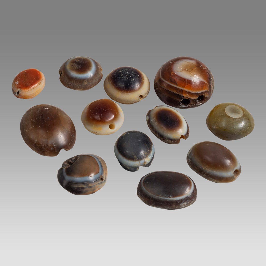 Lot of 12 Bactrian Near Eastern Banded Agate Eye Beads. (1 of 2)
