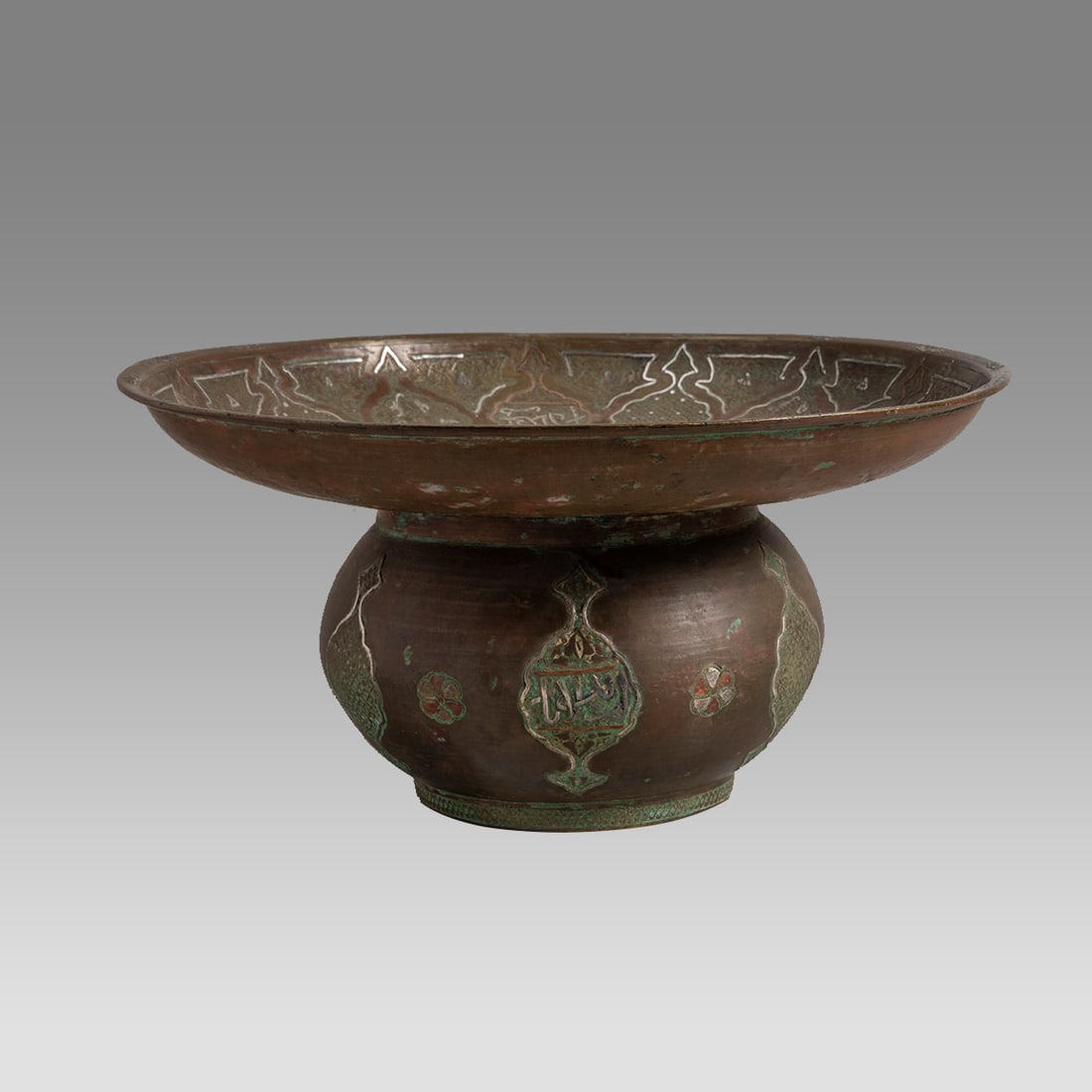 19th century Syrian Islamic Copper Basin, silver inlaid.: 19th century Syrian Islamic Copper Basin, silver inlaid. Size 10 1/4 inches diameter, 4 3/4 inches high. Fine copper basin with silver inlaid decoration and engraved floral design.