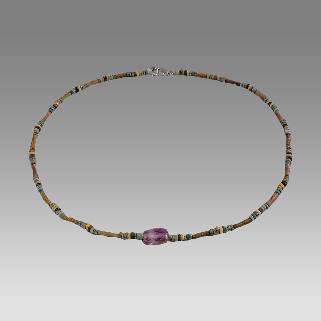 Ancient Egyptian Faience, Bead Necklace c.300-50 BC.: Ancient Egyptian Faience, Bead Necklace c.300-50 BC. Size 18 1/4 inches length. Great Looking single strand Faience Bead necklace with Amethyst bead in the center. wearable. Provenance: Ex Secret Eyes
