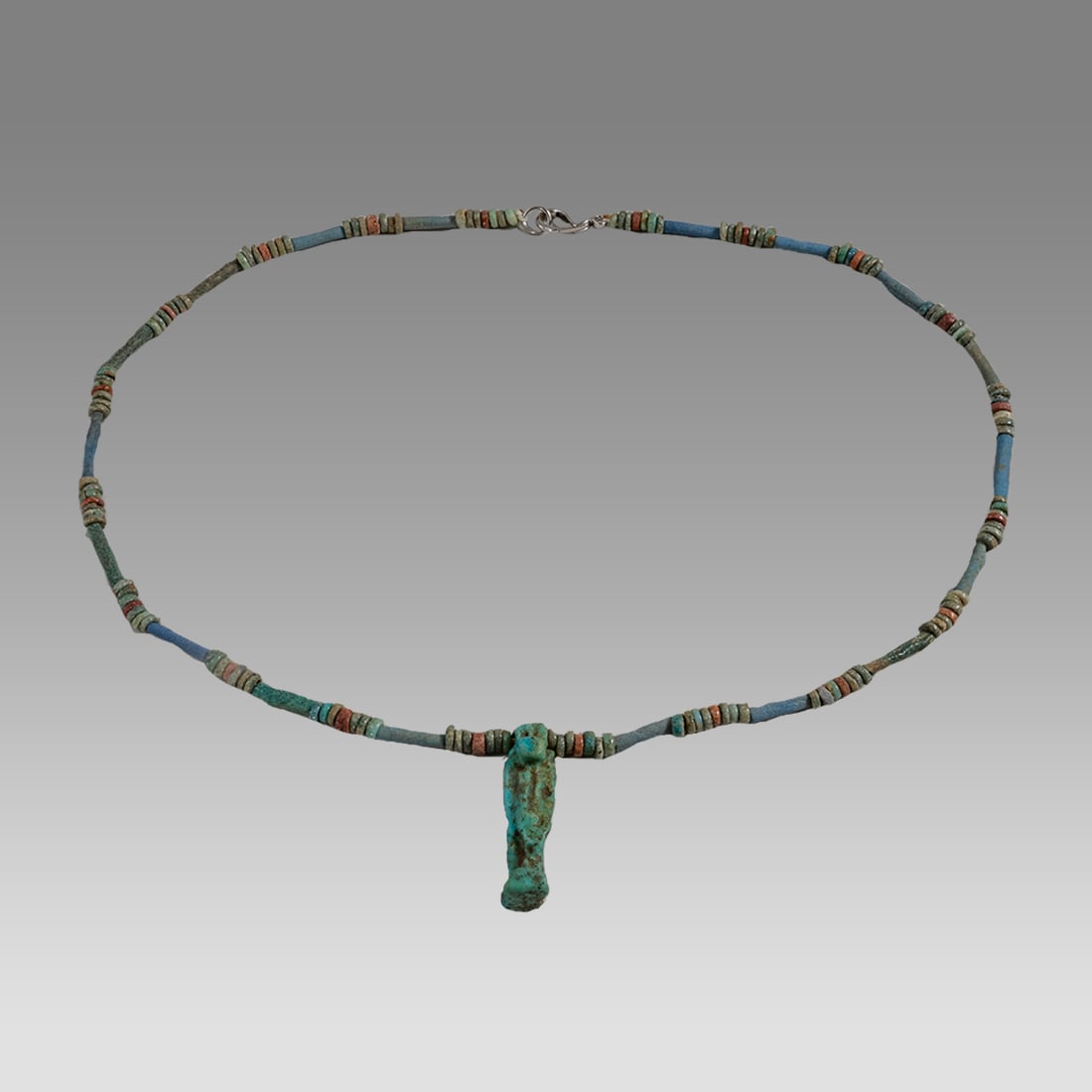 Ancient Egyptian Faience, Bead Necklace c.300-50 BC.: Ancient Egyptian Faience, Bead Necklace c.300-50 BC. Size 19 1/4 inches length. Great Looking single strand Faience Bead necklace with Pataikos amulet. wearable. Provenance: Ex Secret Eyes Gallery New