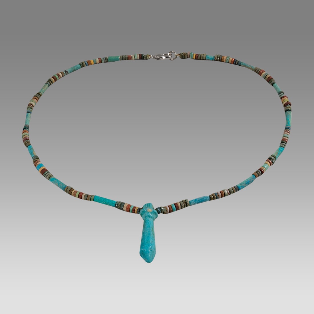 Ancient Egyptian Faience, Bead Necklace c.300-50 BC.: Ancient Egyptian Faience, Bead Necklace c.300-50 BC. Size 18 inches length. Great Looking single strand Faience Bead necklace with Papyrus Wadj faience Amulet. wearable. Provenance: Ex Secret Eyes Gal