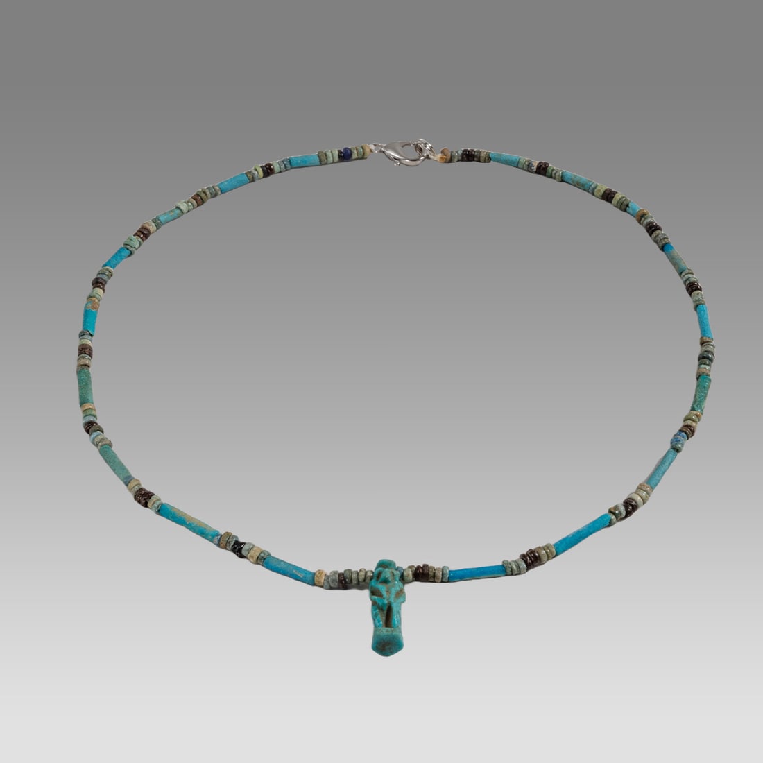 Ancient Egyptian Faience, Bead Necklace c.300-50 BC.: Ancient Egyptian Faience, Bead Necklace c.300-50 BC. Size 17 1/4 inches length. Great Looking single strand Faience Bead necklace with Falcon headed god Horus amulet. wearable. Provenance: Ex Secret E
