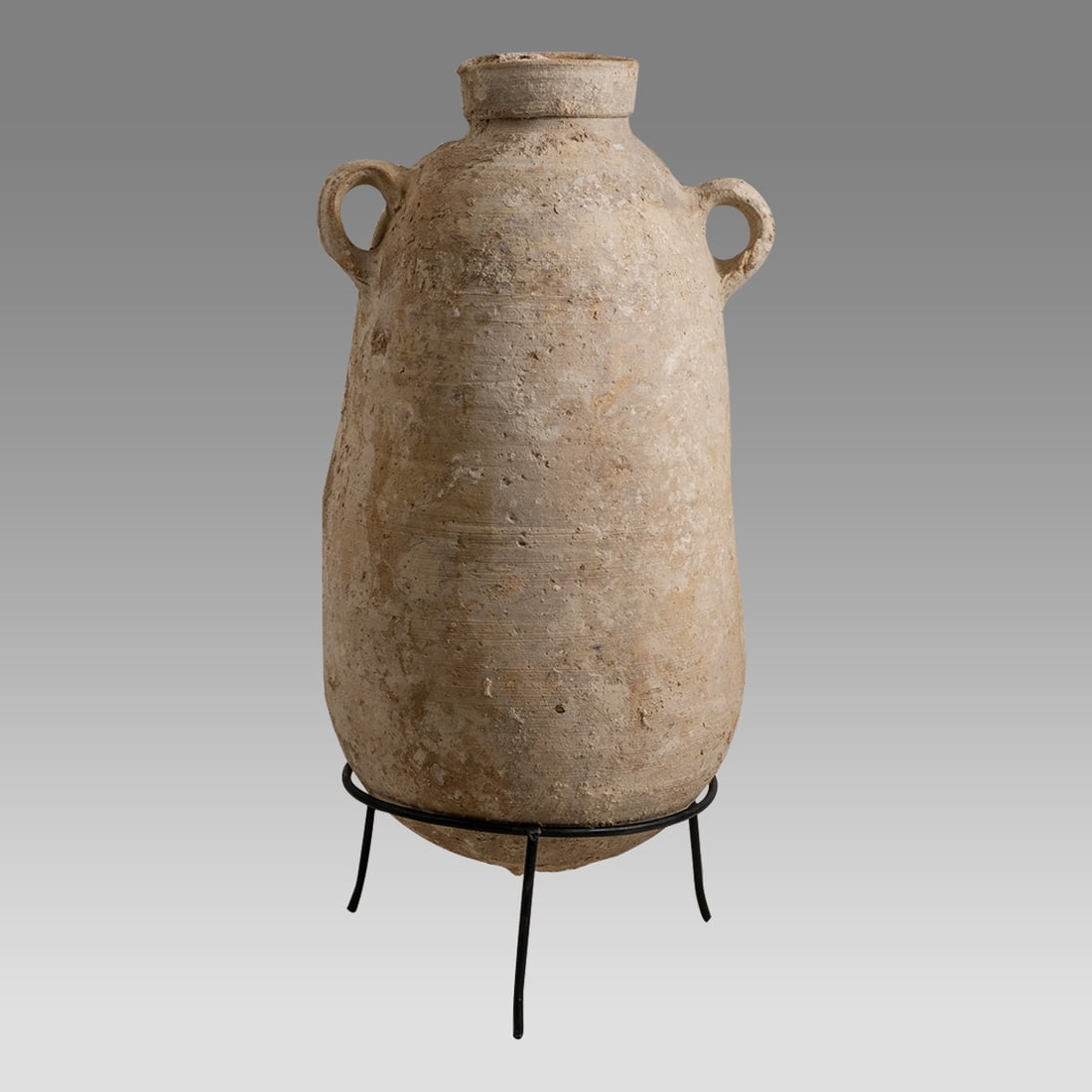 Ancient Holy Land Roman Terracotta Amphora c.1st century AD.: Ancient Holy Land Roman Terracotta Amphora c.1st century AD. Size 17 1/2 inches high + stand, 8 inches widest point. Fine large Terracotta wine amphora with twin loop type handles. Nice deposit on sur