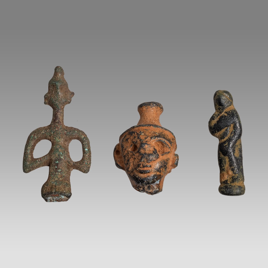 Lot of 3 ANCIENT Canaanite Bronze Idols c.2000 BC.: Lot of 3 ANCIENT Canaanite Bronze Idols c.2000 BC. Size 1 - 1 1/2 inches high.+ stand. Fine lot of 3 cast bronze Idols. Custom mounted. Provenance: Ex David Hendin collection