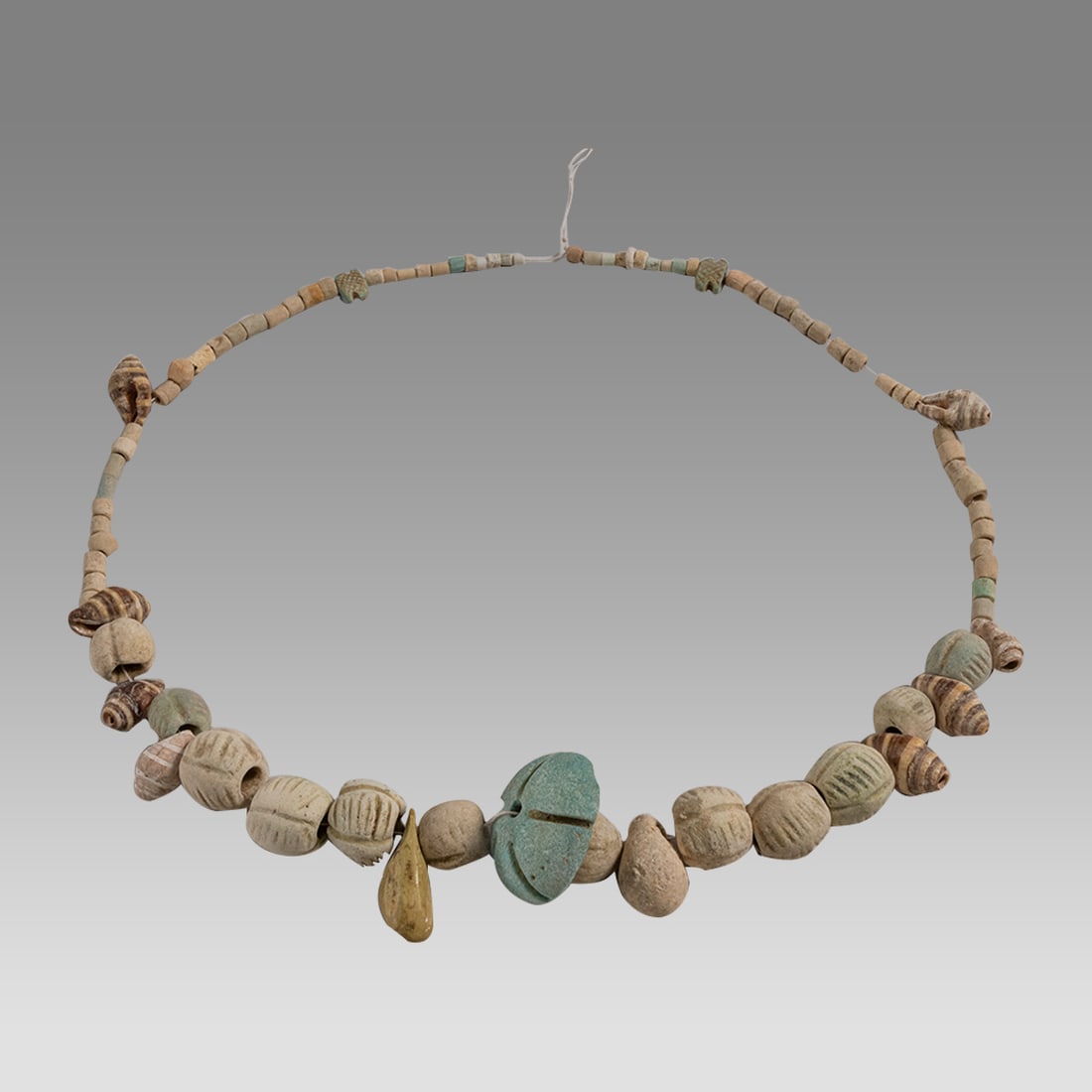 Ancient Roman Faience Beads Necklace c.1st-2nd century AD.: Ancient Roman Faience Beads Necklace c.1st-2nd century AD. Size 16 inches length. size of beads 3 - 24 mm. Ancient Roman faience beads with small shells, in a string, needs restring. Provenance: From