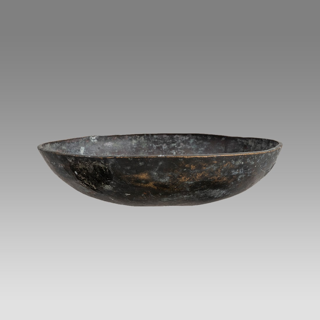 Ancient Luristan Bronze Bowl c.1000 BC.: Ancient Luristan Bronze Bowl c.1000 BC. Size 5 3/4 inches diameter, 2 1/2 inches high. Ashallow bronze bowl with nice black patina. Provenance: From a NYC collection acquired in the 1960s
