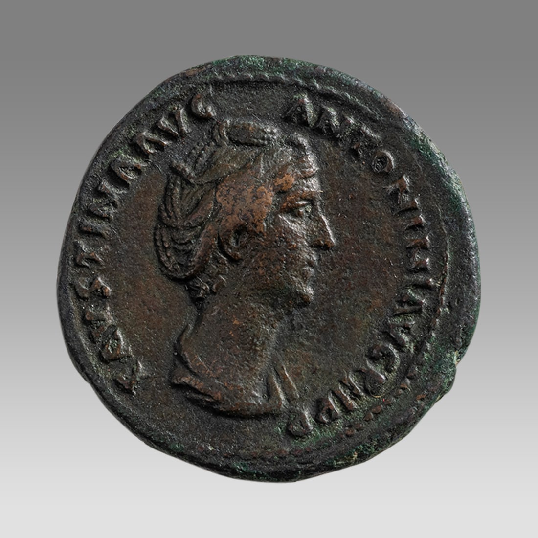 Ancient Roman Faustina I AE Bronze As. Lifetime issue. 139 AD.: Ancient Roman Faustina I AE Bronze As. Lifetime issue. 139 AD. (18mm, 10.06 grams) FAVSTINA AVG ANTONINI AVG PII P P, bust right / CONCORDIA AVG S-C, Concordia seated left with patera and leaning on f