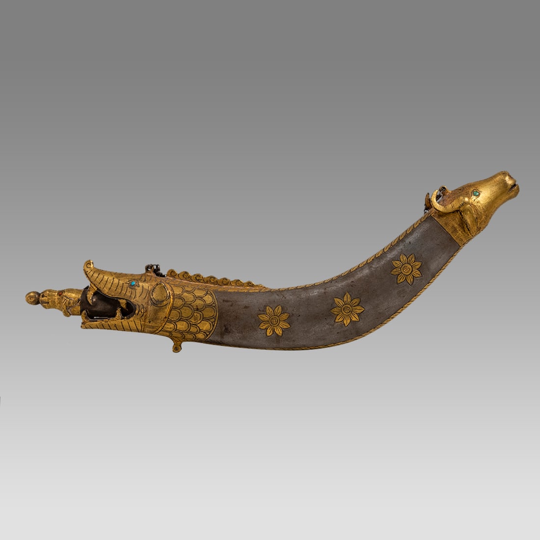 Antique Indian Steel and gold inlay Gun Powder with Bull Head.: Antique Indian Steel and gold inlay Gun Powder with Bull Head. Size 12 1/4 inches length. Fine and unusual Steel Gun powder Fish form with Bull head at each end. Gold plated over design.