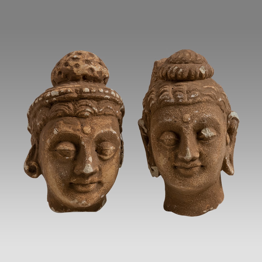 A pair of Gandharan Style Stucco head of Buddha. (1 of 3)