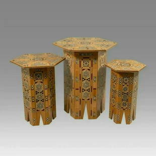 A Set Of Three SYRIAN Moorish octagonal Wood Tables with Inlay geometric design.: A Set Of Three SYRIAN Moorish octagonal Wood Tables with Inlay geometric design.size Largest 19 3/4 inches high x 16 1/4 inches wide. Medium 16 3/4 inches high x 13 inches wide. Small table 15 inches