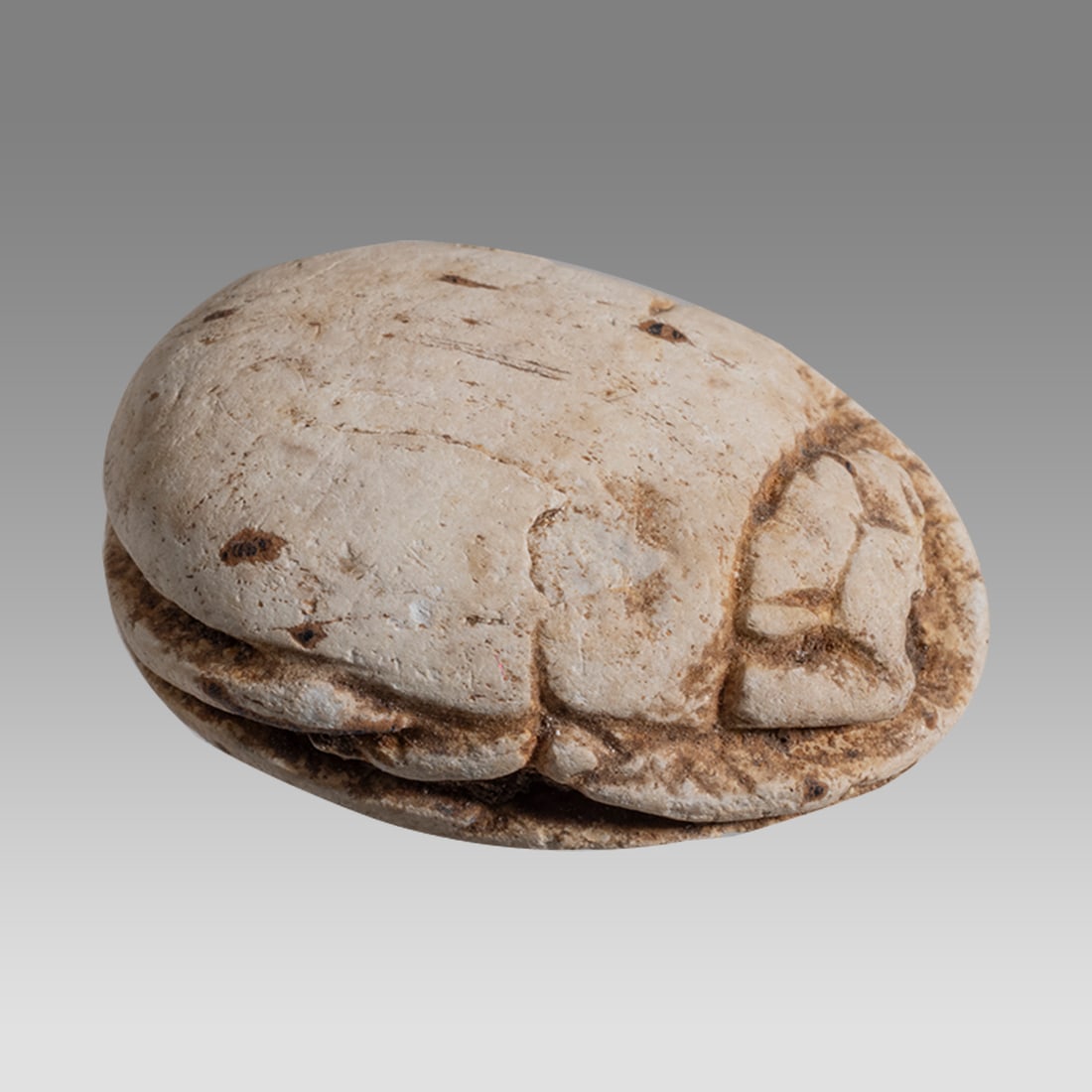 Ancient Egyptian Steatite stone Scarab c.1500-1100 BCE.: Ancient Egyptian Steatite stone Scarab c.1500-1100 BCE. Size 20 x 14 mm. Glazed steatite scarab New Kingdom with stealized beatle back. Scorpion at base. Provenance: Ex Secret Eyes Gallery New York 19
