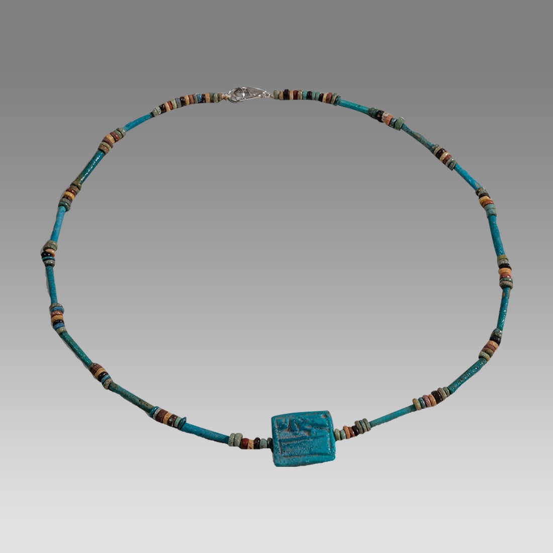 Ancient Egyptian Faience, Bead Necklace With Amulet c.300-50 BC.: Ancient Egyptian Faience, Bead Necklace With Amulet c.300-50 BC. Size 18 1/8 inches length. Great Looking single strand Faience Bead necklace with blue faience eye of horus amulet. wearable. Provenanc