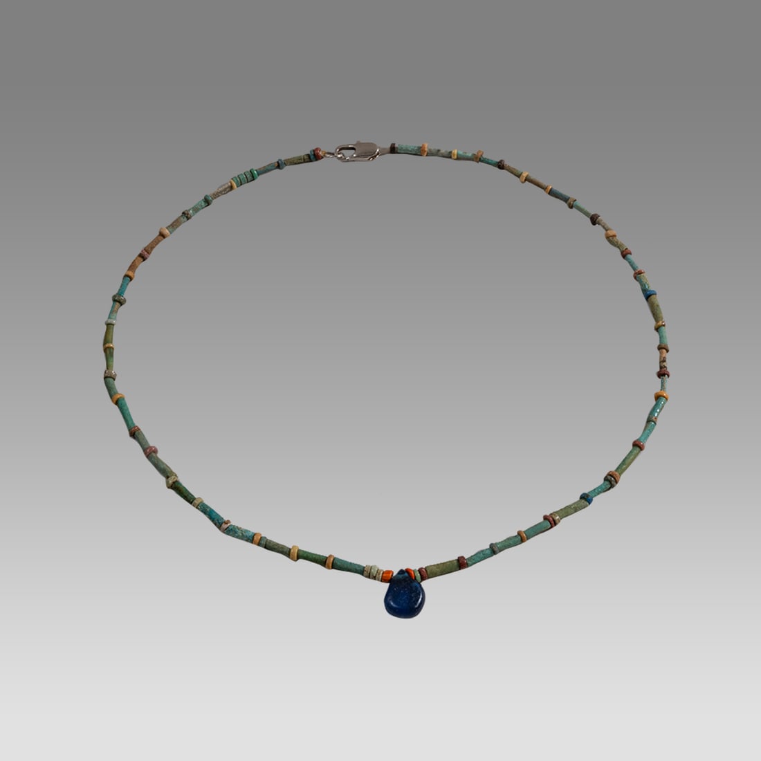 Ancient Egyptian Faience, Bead Necklace c.300-50 BC.: Ancient Egyptian Faience, Bead Necklace c.300-50 BC. Size 18 inches length. Great Looking single strand Faience Bead necklace with blue glass amulet. wearable. Provenance: Ex Secret Eyes Gallery New Y