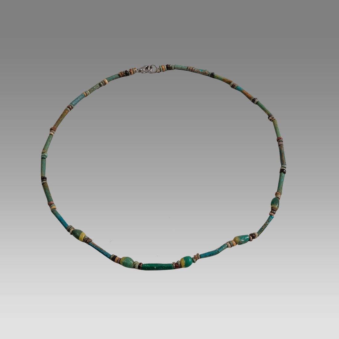 Ancient Egyptian Faience, Bead Necklace c.300-50 BC.: Ancient Egyptian Faience, Bead Necklace c.300-50 BC. Size 18 1/4 inches length. Great Looking single strand Faience Bead necklace with green/yellow glass beads. wearable. Provenance: Ex Secret Eyes Ga