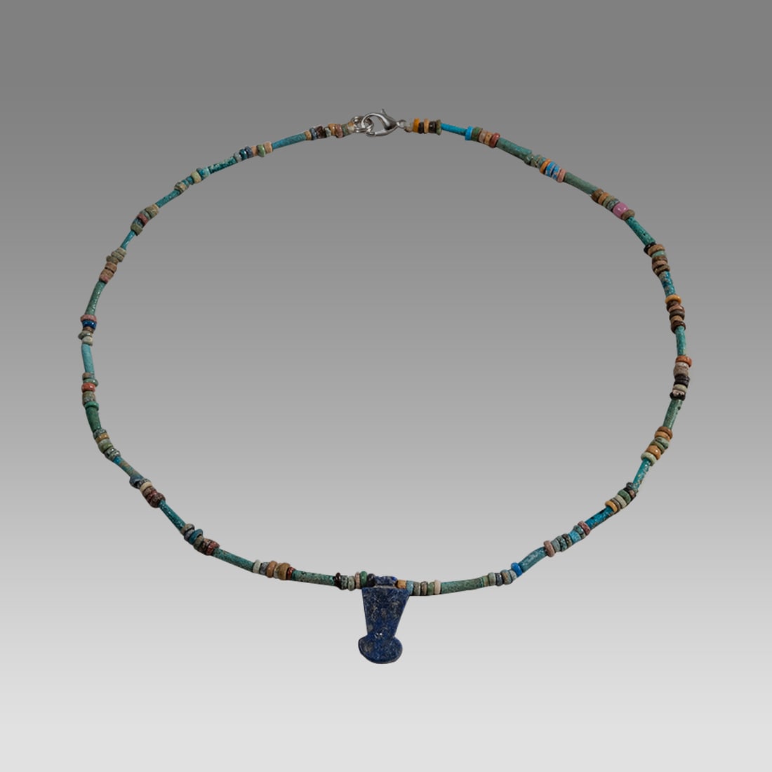 Ancient Egyptian Faience, Bead Necklace c.300-50 BC.: Ancient Egyptian Faience, Bead Necklace c.300-50 BC. Size 17 inches length. Great Looking single strand Faience Bead necklace with lapis lazuli crown amulet. wearable. Provenance: Ex Secret Eyes Galle
