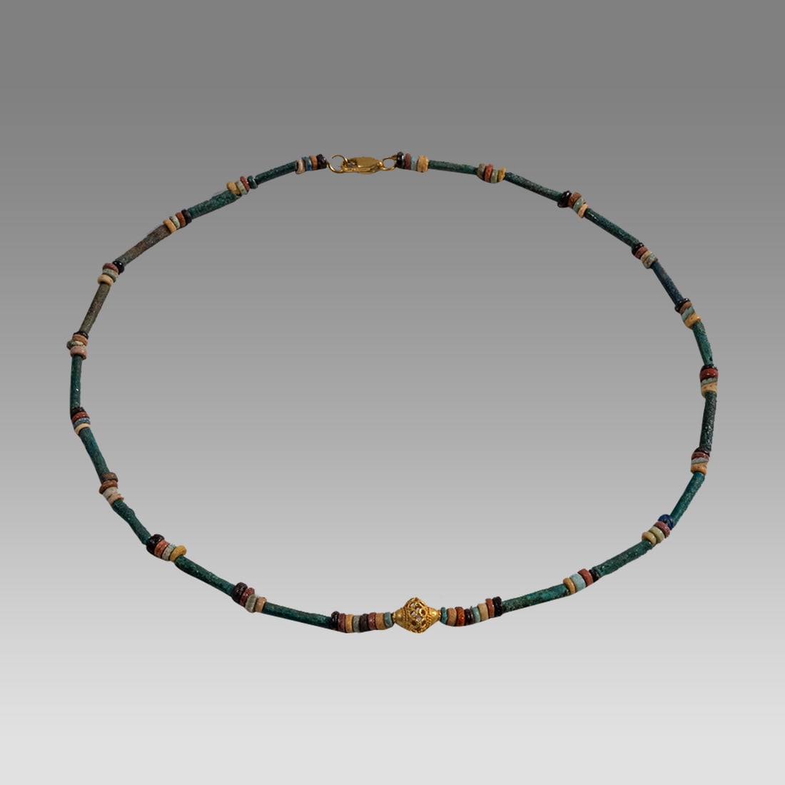 Ancient Egyptian Faience, Bead Necklace c.300-50 BC.: Ancient Egyptian Faience, Bead Necklace c.300-50 BC. Size 17 1/4 inches length. Great Looking single strand Faience Bead necklace with gold bead. wearable. Provenance: Ex Secret Eyes Gallery New York 