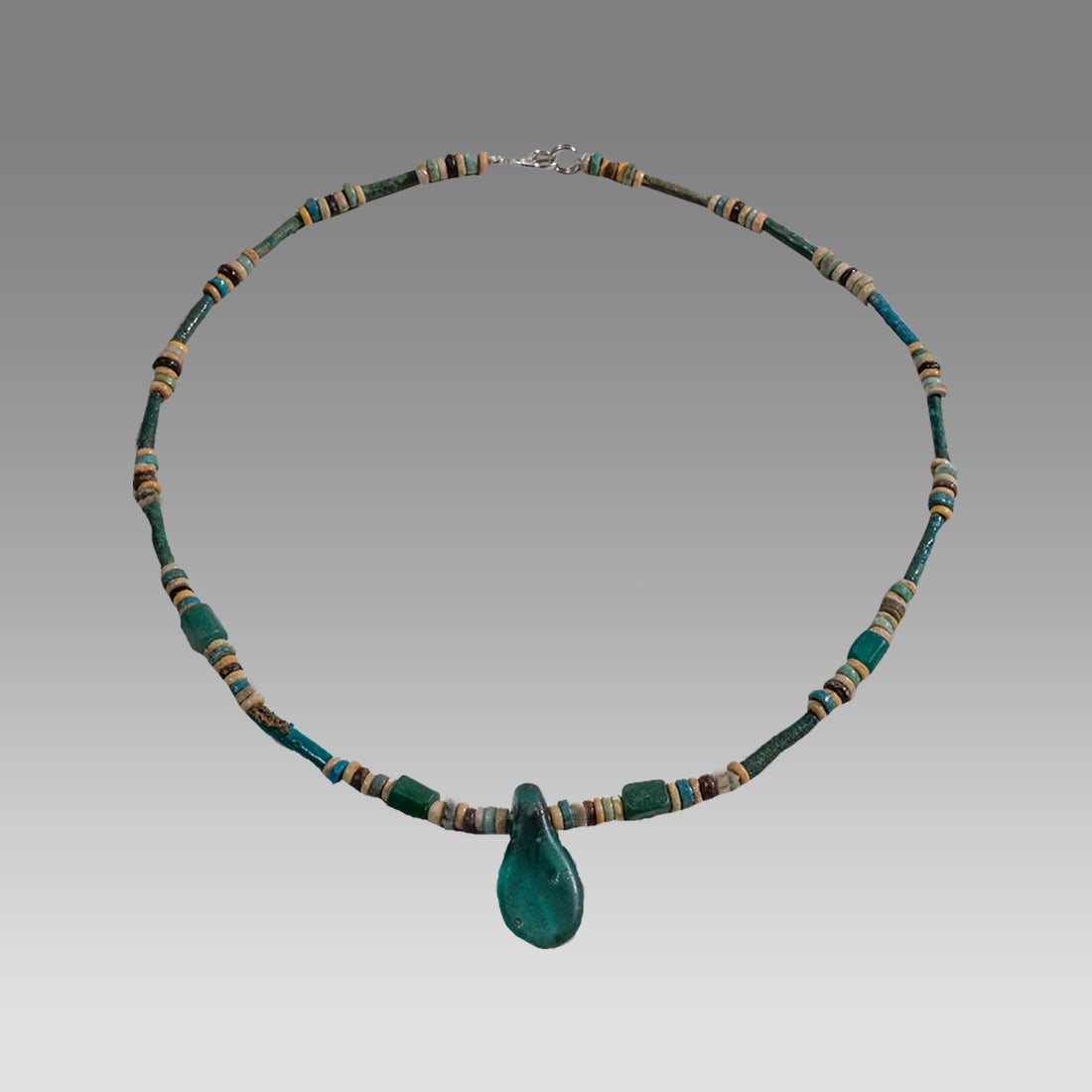 Ancient Egyptian Faience, Bead Necklace c.300-50 BC.: Ancient Egyptian Faience, Bead Necklace c.300-50 BC. Size 17 1/2 inches length. Great Looking single strand Faience Bead necklace with green glass Amulet. wearable. Provenance: Ex Secret Eyes Gallery 