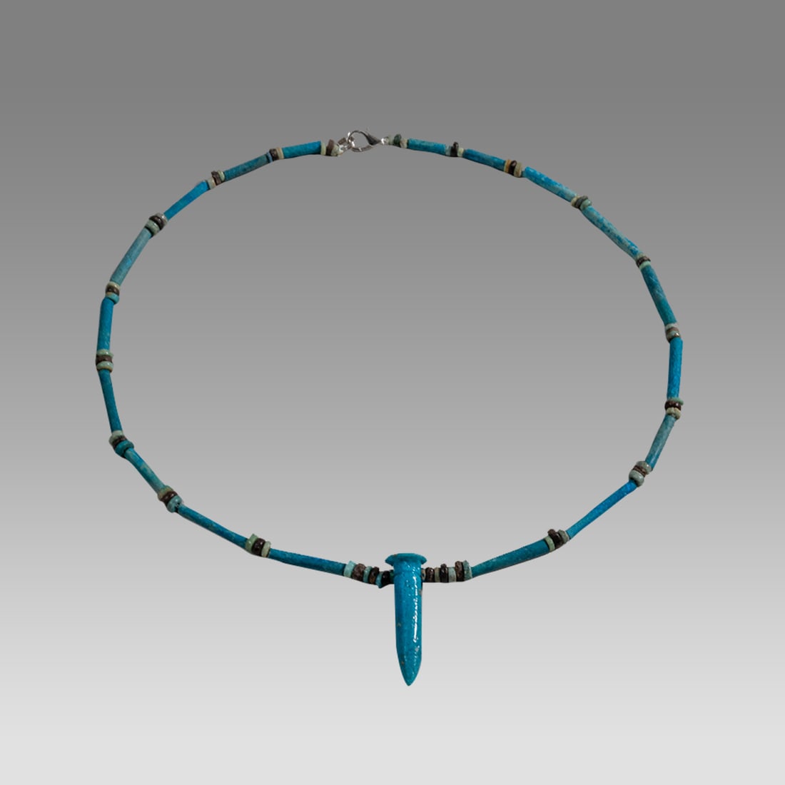 Ancient Egyptian Faience, Bead Necklace c.300-50 BC.: Ancient Egyptian Faience, Bead Necklace c.300-50 BC. Size 19 1/2 inches length. Great Looking single strand Faience Bead necklace with blue faience Papyrus amulet. wearable. Provenance: Ex Secret Eyes