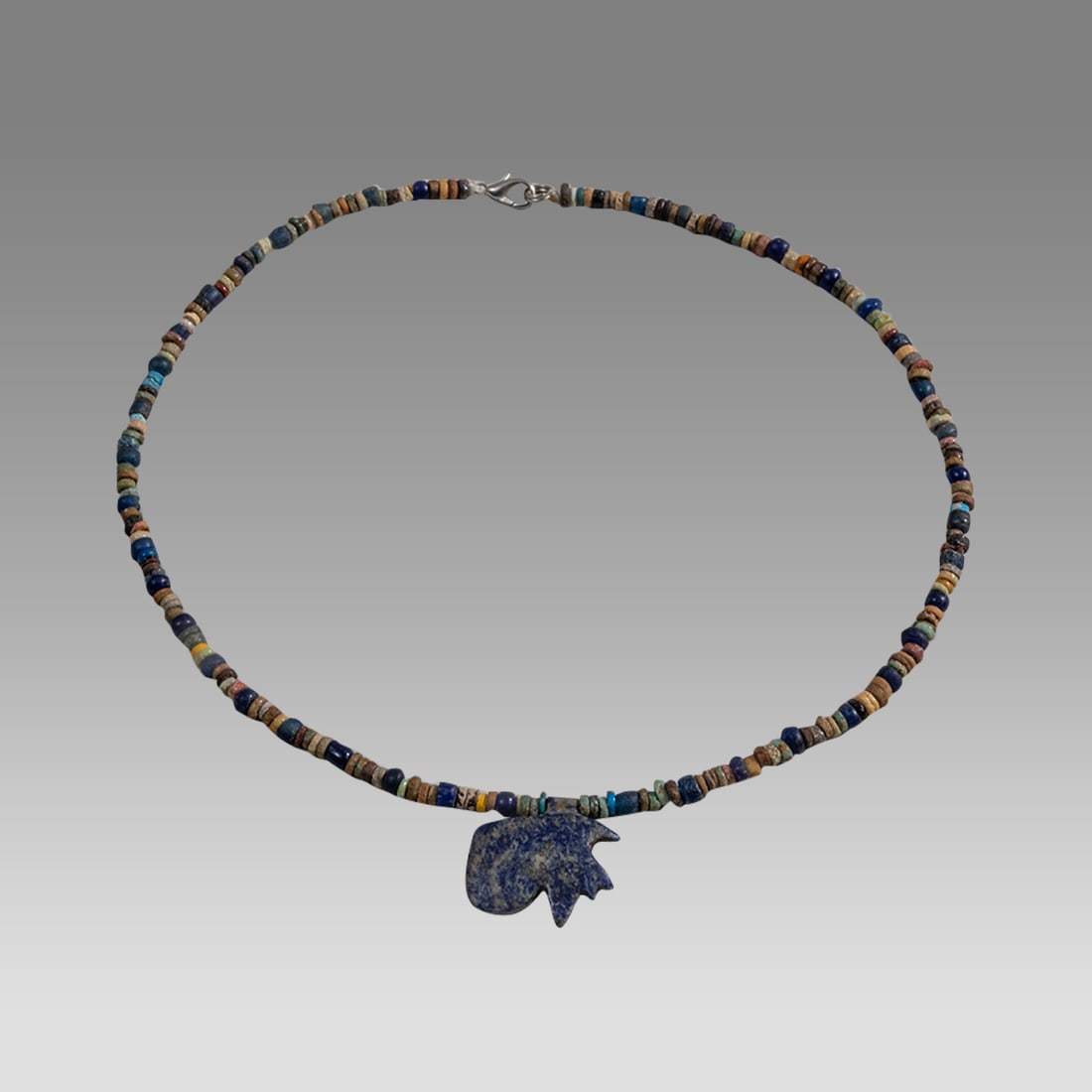 Ancient Egyptian Faience, Bead Necklace c.300-50 BC.: Ancient Egyptian Faience, Bead Necklace c.300-50 BC. Size 17 3/8 inches length. Great Looking single strand Faience Bead necklace with Lapis lazuli eye of horus amulet. wearable. Provenance: Ex Secret