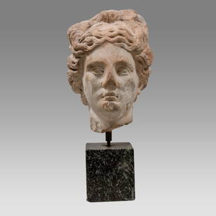 Ancient Roman Marble Head of Apollo c.1st century AD.: Ancient Roman Marble Head of Apollo c.1st century AD. Size 8 1/4 inches high, + Stand. (Size with the stand 12 1/2 inches high) The youthful god depicted finely-carved features, his head facingt, almo